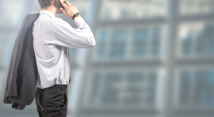 businessman works on smartphone at the office - People isolated on modern office background