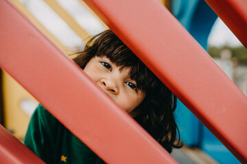 Fototapeta na wymiar Cute girl on playground