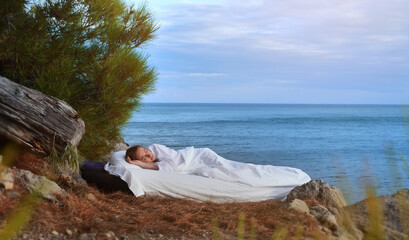 Sleeping woman rest on airbed with amazing nature view