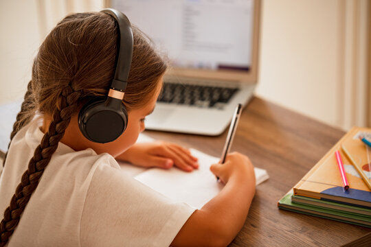 Autistic Child Writes Homework On His Own. Remote Education. Back View.  