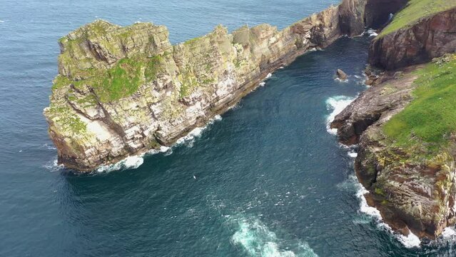 The cliffs and sea stacks An Tor Mor and the Wishing Stone at Port Challa on Tory Island, County Donegal, Ireland
