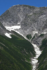 Obraz premium Low snow and ice in remote valley.