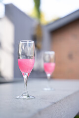 glass of pink champagne at bar