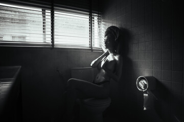 black and white young asian women model sitting poses naked by the window light in bathroom, lady...