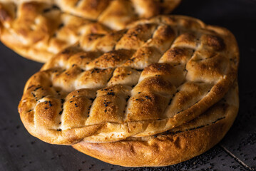 Ramadan Pita (Ramazan Pidesi). Traditional Turkish bread for holy month Ramadan. Dark food...