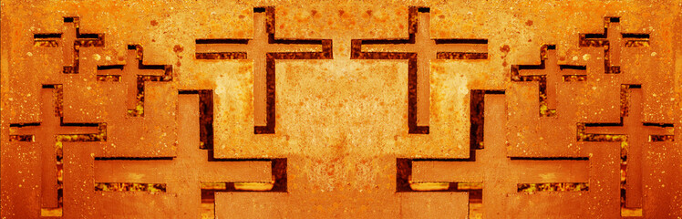Abstract yellow orange rusty religious background banner panorama - Old weathered metal fence with cross shape symbol on cemetery