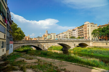 Fototapeta na wymiar Panoramic view of the downtown of Girona city. The river and the bridge