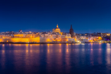 Fototapeta na wymiar Skyline of Valletta by night, view from Sliema, Malta