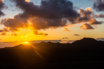 Obraz premium Amazing sunset over El Cuervo Volcano, in Lanzarote, Canary Islands, Spain