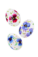 Easter eggs with violets isolated on a white background
