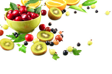 ripe cherry fruit and berries in a bowl of pistachio on a white background, space for text, horizontal