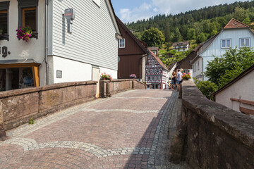 Townscape with a historic bridge in Alpirsbach in the Black Forest, Baden-Wurttemberg, Germany,...