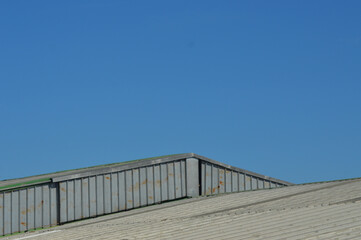 roof of a factory with blue sky