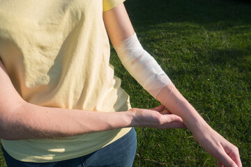 Woman with the bandage on the wound. Bleeding injury hand.