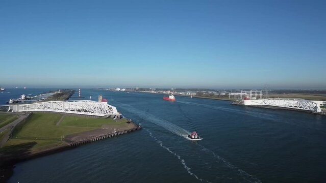 Aerial top down photo Maeslantkering storm surge barrier on the Nieuwe Waterweg Netherlands it closes if the city of Rotterdam is threatened by floods and is one of largest moving structures on earth