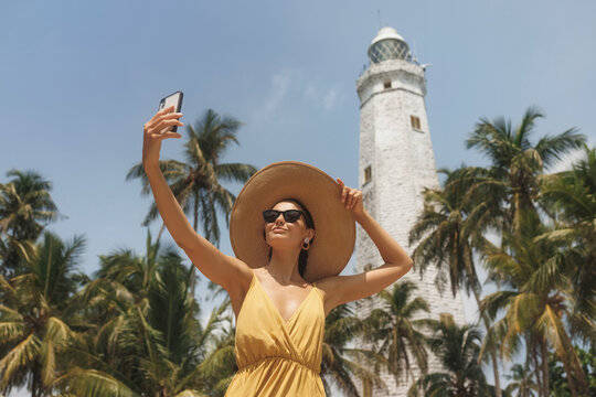 Selfie on Smartphone of Woman Traveler in Front of Famous Landmark of