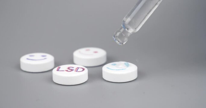 pipette with diethylamine lysergic acid drops for lsd white tablets. High quality 4k footage
