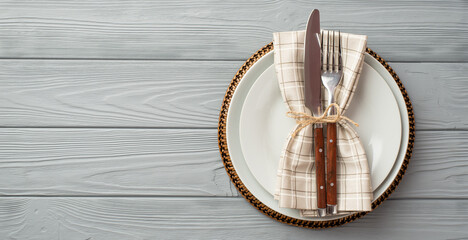 Thanksgiving day concept. Top view photo of table setting plate knife fork and napkin on isolated...