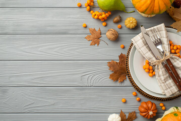 Thanksgiving day concept. Top view photo of plate knife fork napkin maple leaves raw vegetables...