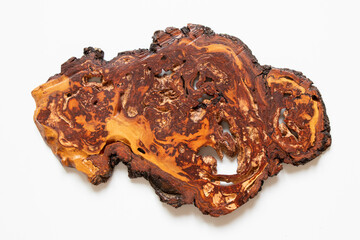 Decorative wooden board for serving food on a white background, an old board with holes, a wooden