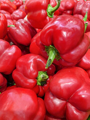 Ripe red peppers on the shelf in the grocery store