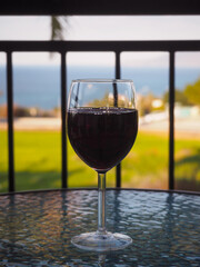 glass of red wine in afternoon