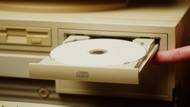 Using CD circle disk for old computer. Dvd player, disc drive. Music recorder, playing retro computer games. 
