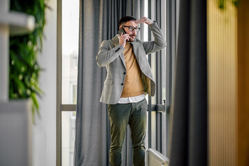 Fototapeta premium Mad young adult manager, touching his forehead, confused.