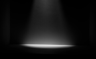 Light and shadow illuminate the black space room.