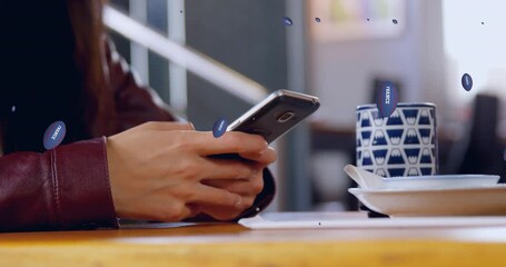 Animation of rugby balls with france text over caucasian woman using smartphone - Powered by Adobe