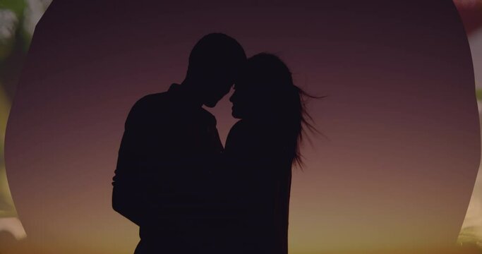 Animation of couple embracing over clouds