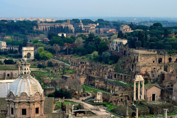 Fototapeta na wymiar Panoramic view of ancient Roman ruins with cathedrals, arches, columns, gates, The Palatine Hill (Palatino), Rome, the capital of Italy. Best Roman landscapes, Best Roman scenery