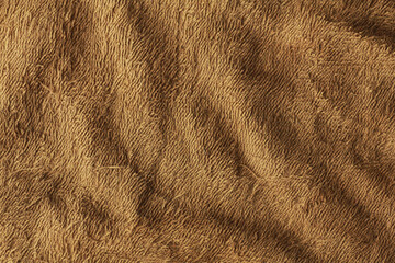 Old orange towel texture background. Pulled threads on towel. Old terry cloth texture background Household bath toweling cloth, used towel closeup texture