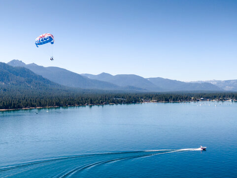 Two people parasailing in South Lake Tahoe, California.