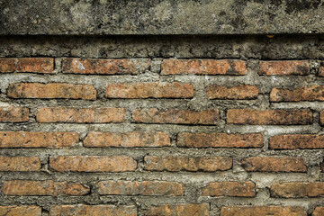 Empty Old Brick Wall Texture. Painted Distressed Wall Surface. Grungy Wide Brickwall. Grunge Red Stonewall Background. Shabby Building Facade With Damaged Plaster. 