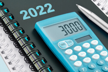 3000 Euro und blauer Rechner mit Kalender 2022 - obrazy, fototapety, plakaty