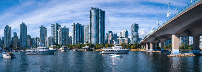 Vancouver city skyline buildings and Cambie Bridge over Quayside Marina in False Creek near English Bay in British Columbia, Canada