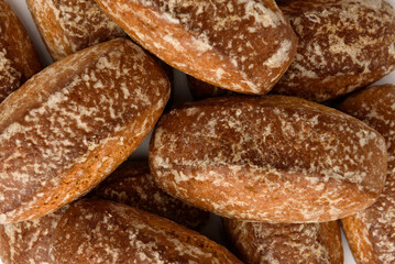 Pile of honey gingerbread cookies isolated on white background.
