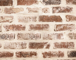A light red brick and cream wall