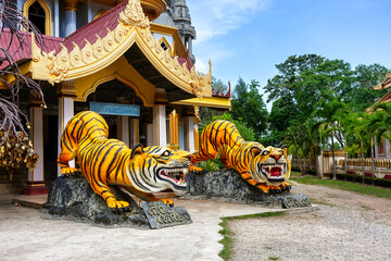 Statues of tigers at entrance to buddhist pagoda Tham Sua near Tiger Cave Temple in Krabi, Thailand