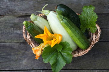 Fresh zucchini, green vegetables on local farmer market, freshly harvested courgette, summer squash