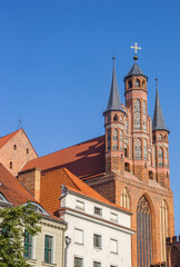Fototapeta na wymiar Old houses and the St. Mary church in Torun, Poland