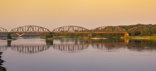 Panorama evening light over the bridge crossing the Wisla river in Torun, Poland