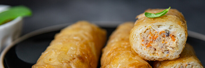 Nem asian food meat vegetable nems spicy sauce cuisine deep fried spring rolls fresh meal on the table copy space food background