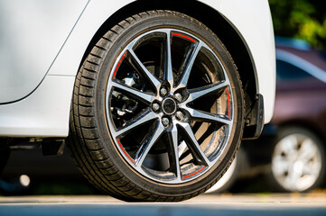 sports car wheels, low profile tires on aluminum rims, closeup