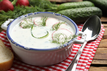 Delicious cold summer soup on wooden table, closeup