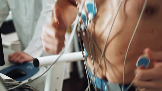 Muscular Man Athlete Running On Treadmill In Gym For Monitoring Test His Sport Performance. Sportsman In Sports Science Lab Measuring Cardio Respiratory, Heart Check.