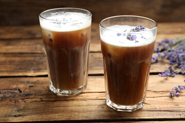 Delicious coffee with lavender on wooden table