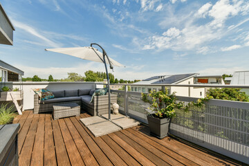 Sitting area in balcony with comfortable furniture around beautiful view