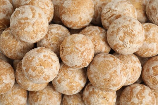 Tasty homemade gingerbread cookies as background, top view